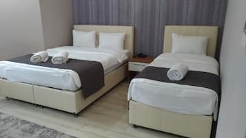 Family Quadruple Room | Premium bedding, minibar, in-room safe, desk