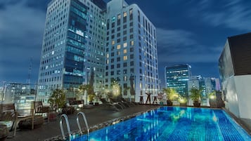 Outdoor pool, open 6:00 AM to 10:00 PM, pool umbrellas, sun loungers