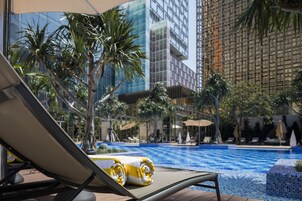 Seasonal outdoor pool, open 8:00 AM to 8:00 PM, pool umbrellas