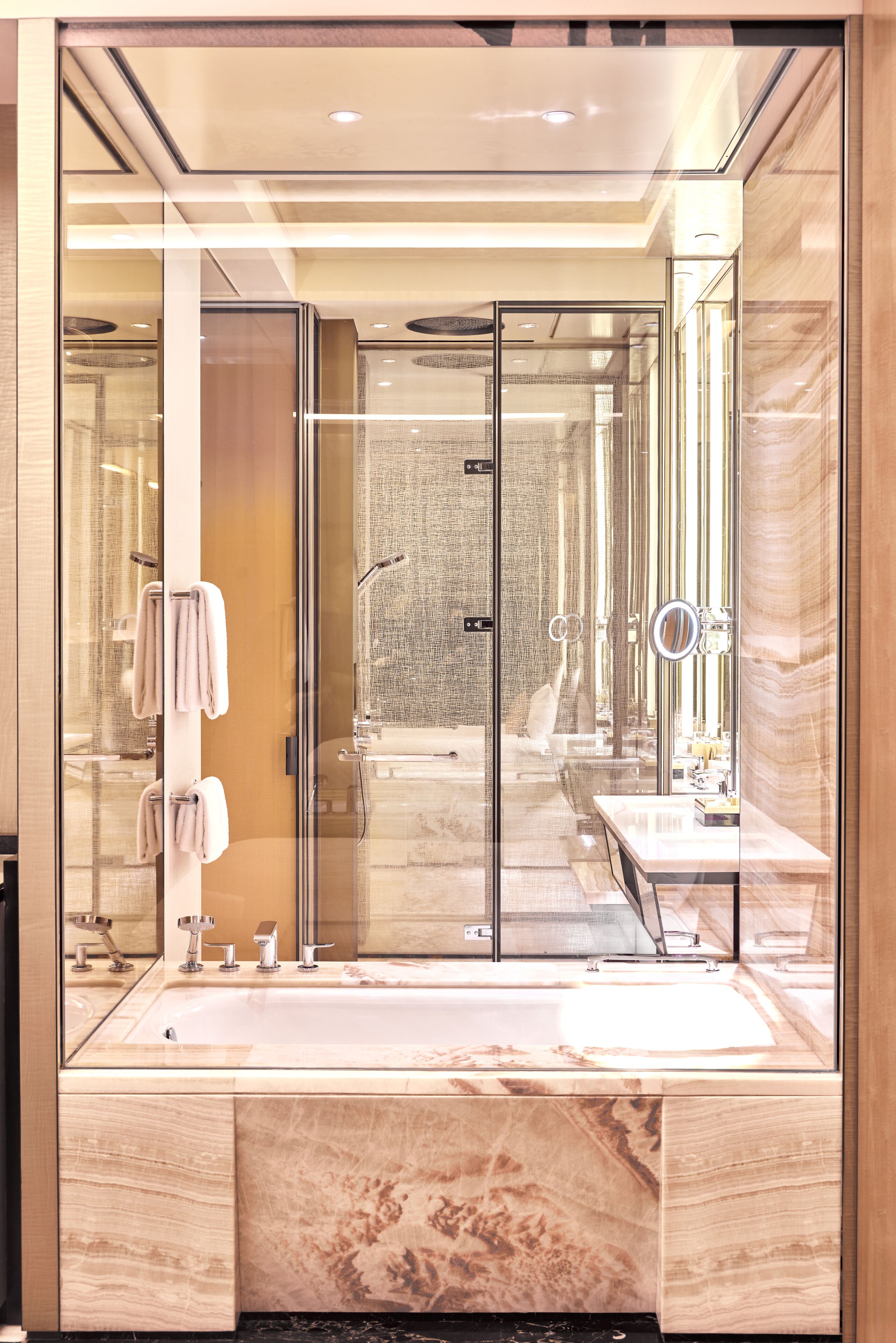 separate bathtub and shower, rainfall showerhead, designer toiletries