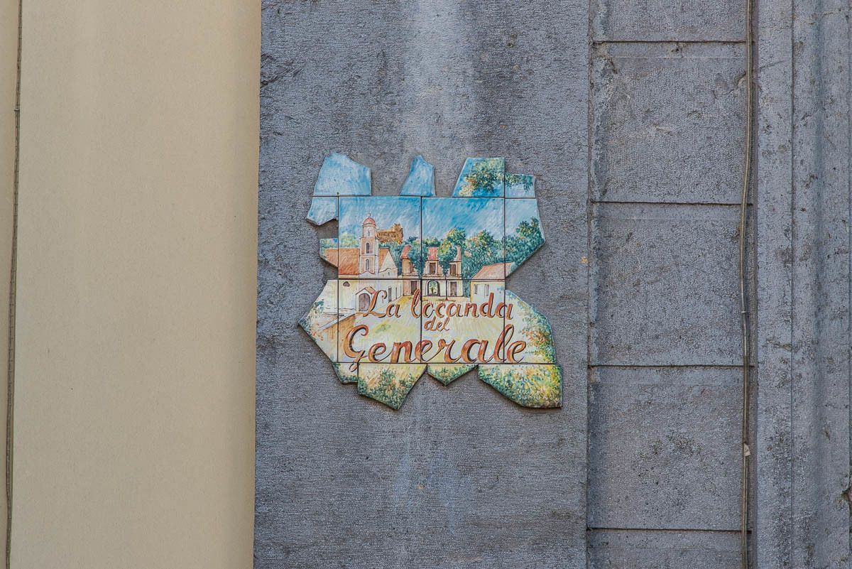 A wall-mounted sign with a map and text.