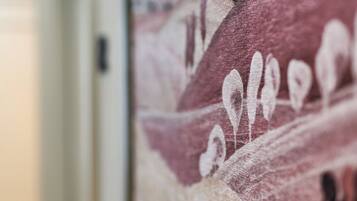 A close-up of a textured wall with a pattern of shapes and lines.