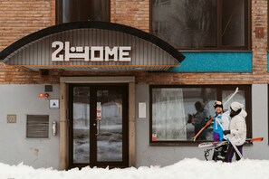 A building with a sign reading "2HOME" above the entrance. - 2Home Hotel Gävle (Gävle)