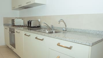 Apartment, 2 Bedrooms, Pool View | Private kitchenette | Full-sized fridge, microwave, oven, stovetop