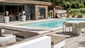 Outdoor pool, open 8 AM to 10 PM, pool umbrellas, sun loungers