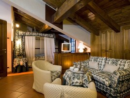 Superior Suite, 1 King Bed, Balcony, Mountain View | Living area | Flat-screen TV