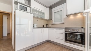 Apartamento Deluxe, planta baja (A1) | Cocina privada