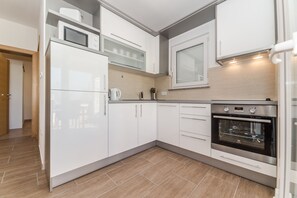 Appartement Deluxe, rez-de-chaussée (A1) | Cuisine privée