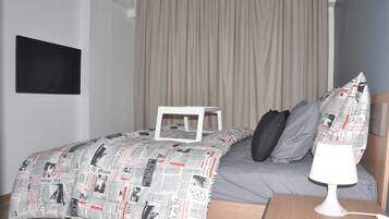 2 bedrooms, blackout drapes, soundproofing, iron/ironing board