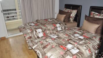 2 bedrooms, blackout drapes, soundproofing, iron/ironing board