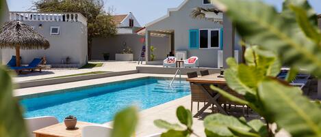 Outdoor pool, pool umbrellas, sun loungers