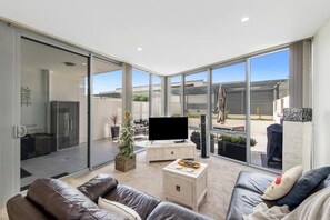 Deluxe Apartment | Living area | LCD TV, DVD player - Accommodate Canberra - Lakefront (Kingston)