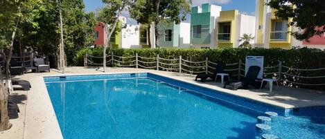 Outdoor pool, open 6 AM to 9 PM, pool umbrellas, sun loungers