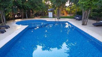 Outdoor pool, open 6 AM to 9 PM, pool umbrellas, sun loungers