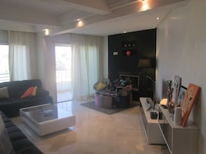 Apartment, 2 Bedrooms | Living area | 40-inch flat-screen TV with satellite channels, TV