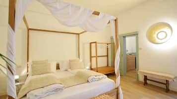 Suite (Giardino) | 1 camera, minibar, una scrivania, tende oscuranti