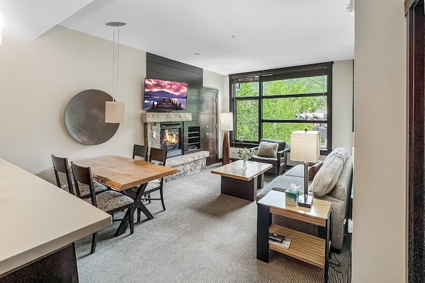 Enjoy year round views in the bright living room with big windows