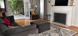 TV, fireplace, books
