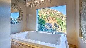 Bathtub, hair dryer, towels, soap