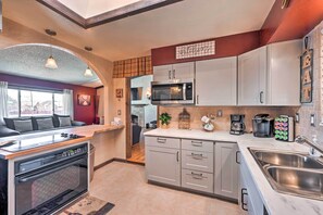 Fridge, microwave, stovetop, dishwasher - Arvada Home w/ Deck & Game Room Near Olde Town! (Arvada)