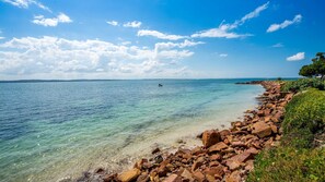 On the beach, sun-loungers