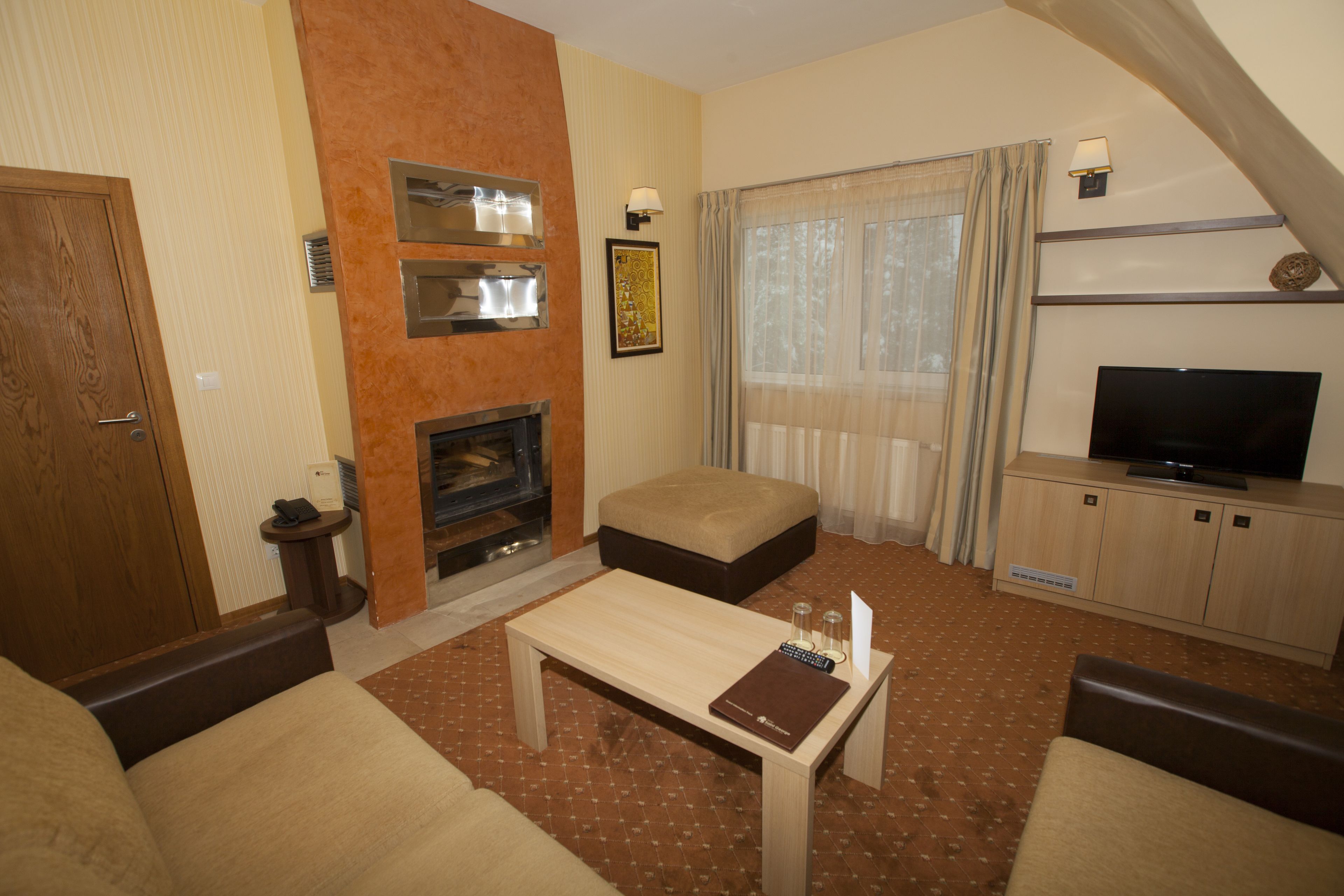 luxury suite | living room | flat-screen tv, fireplace