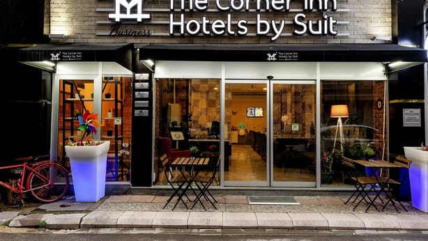 The Corner Inn Hotels by Suit with a modern facade, glass entrance, and outdoor seating area. - The Corner Inn Hotel Suit (Eskisehir)