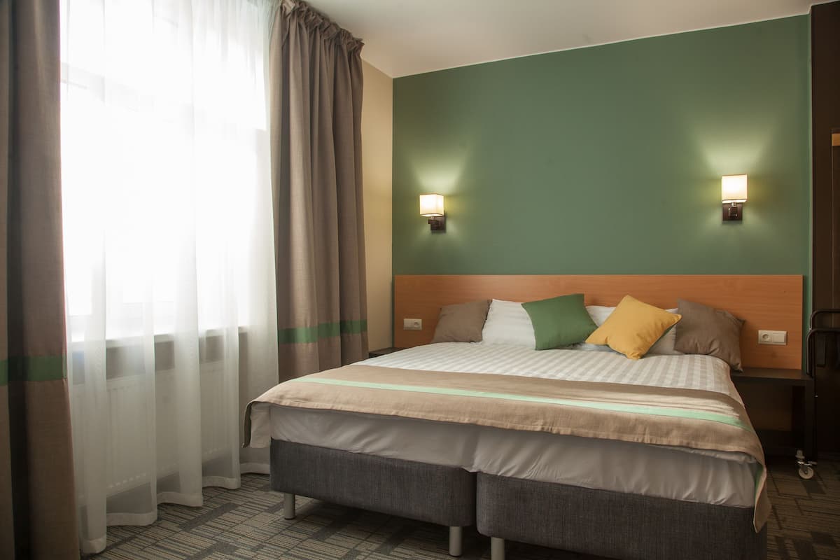 Familienzimmer | Zimmersafe, Verdunkelungsvorhänge, schallisolierte Zimmer