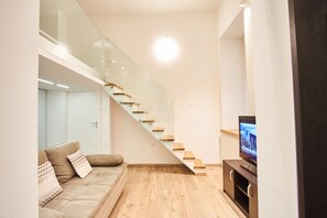 Deluxe Apartment, 1 Queen Bed, Non Smoking | Living area | Flat-screen TV