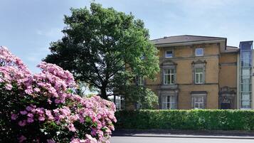 A building with a classic architectural style, featuring a brick facade and large windows.