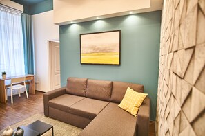 Appartamento Basic | Area soggiorno | TV a schermo piatto