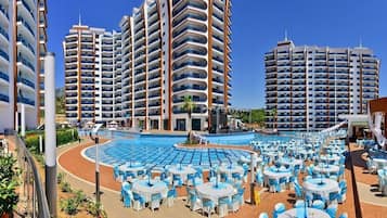 Indoor pool, seasonal outdoor pool, pool umbrellas, pool loungers