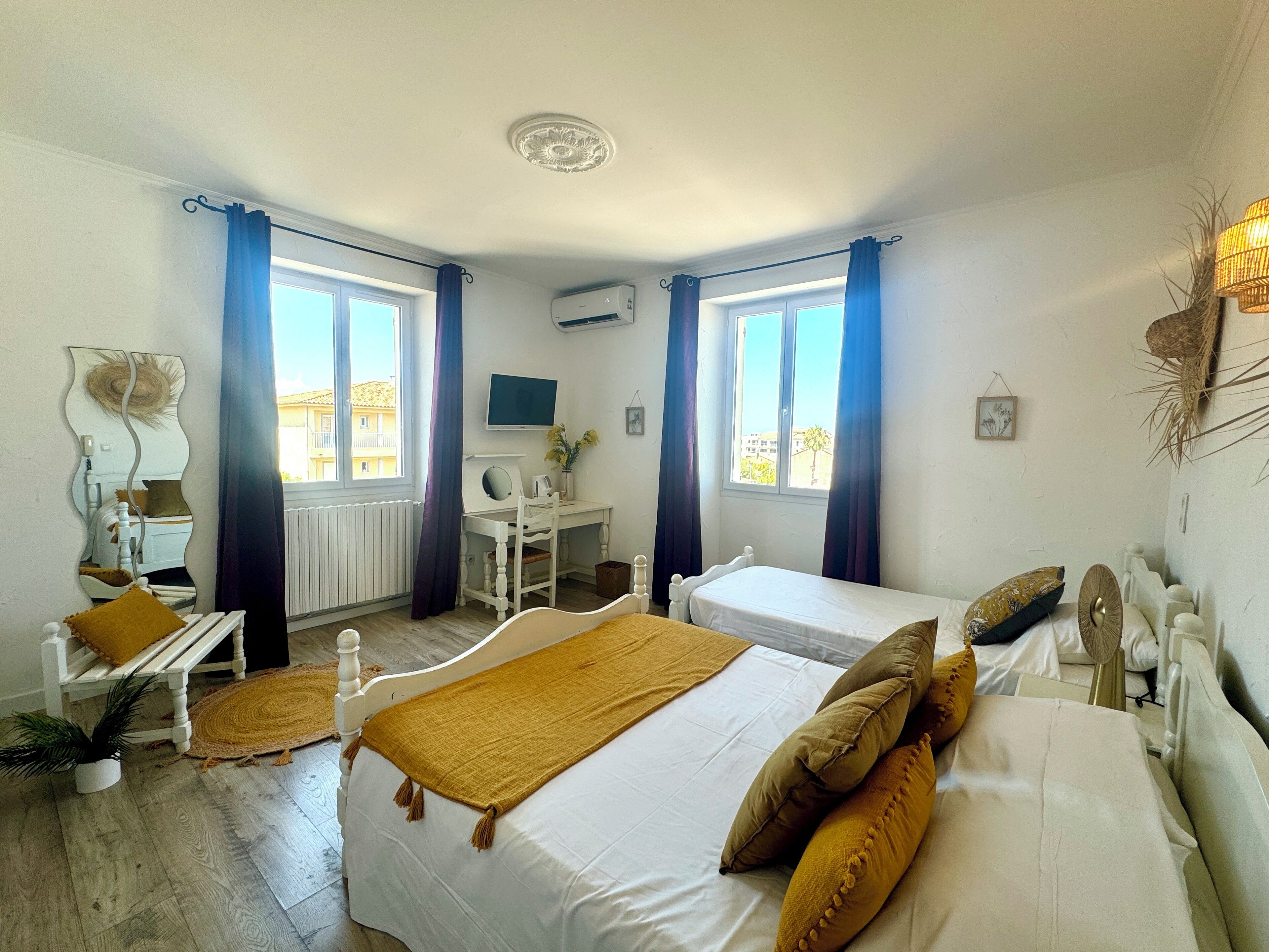 Standard Triple Room | Minibar, individually decorated, individually furnished, desk