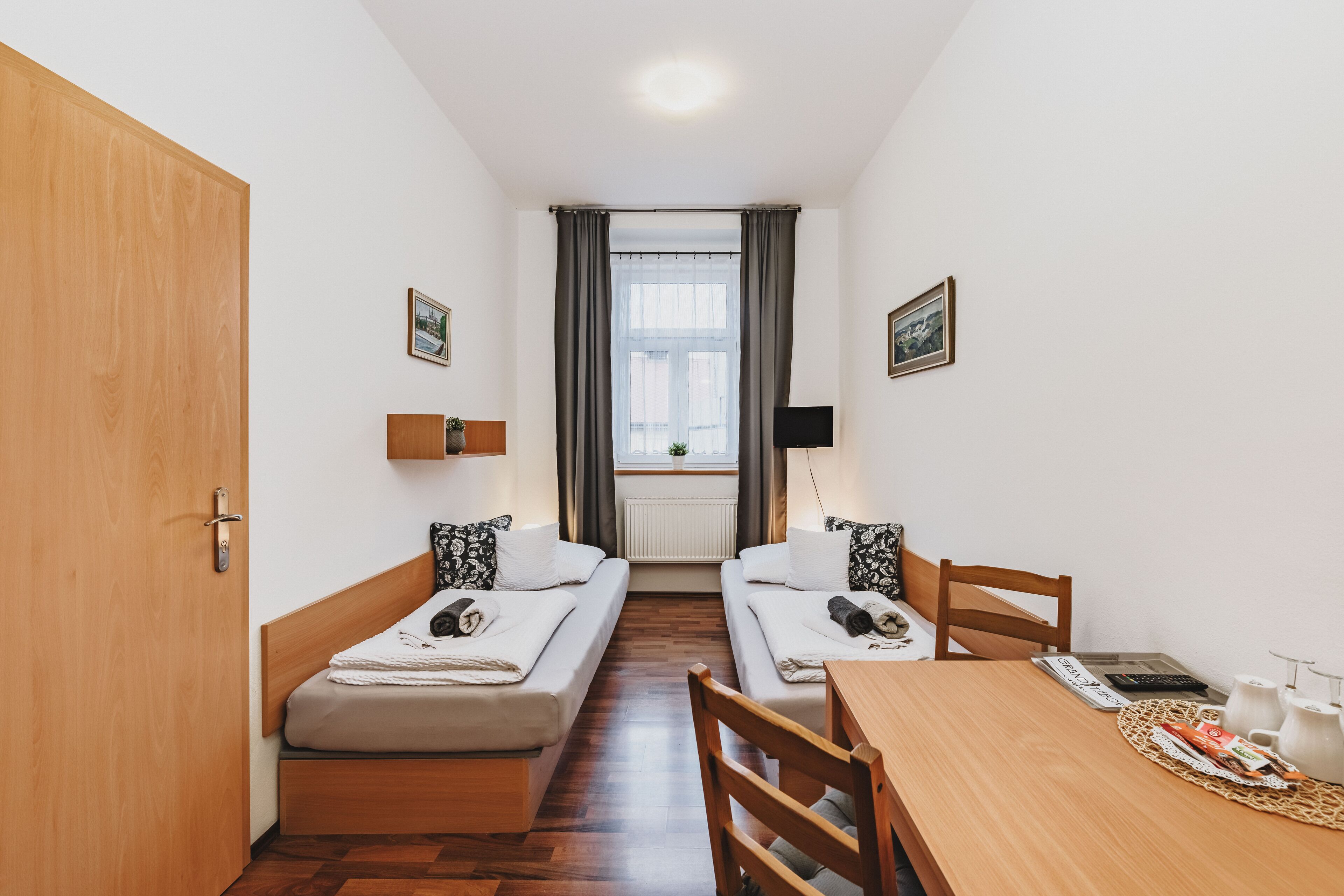 economy twin room, shared bathroom | 1 bedroom, in-room safe, desk, laptop workspace