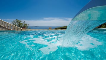 Seasonal outdoor pool, pool umbrellas, pool loungers