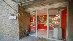 A storefront with a sign reading "Italian Style Food." - Suite 9 The Village (Windhoek)