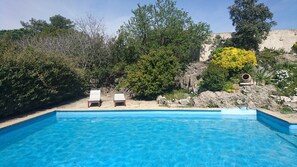 Seasonal outdoor pool, open 9:00 AM to 7:00 PM, pool umbrellas