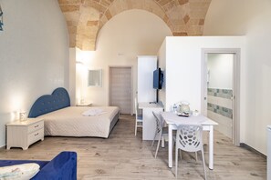 Superior Quadruple Room, 1 Bedroom, Kitchenette, City View | Premium bedding, minibar, individually decorated, individually furnished