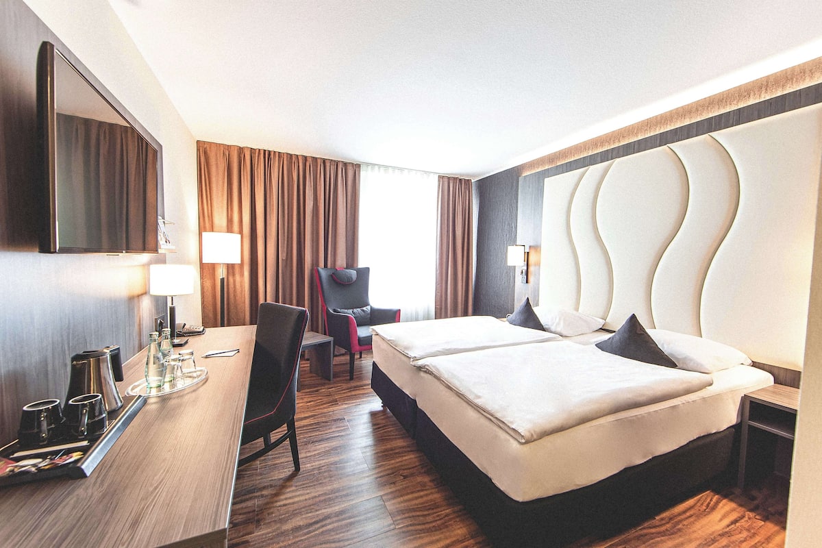 Standaard kamer, 2 eenpersoonsbedden | Een kluis op de kamer, verduisterende gordijnen, gratis babybedden