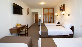 Basic Quadruple Room, Multiple Beds | Minibar, in-room safe, desk, free WiFi
