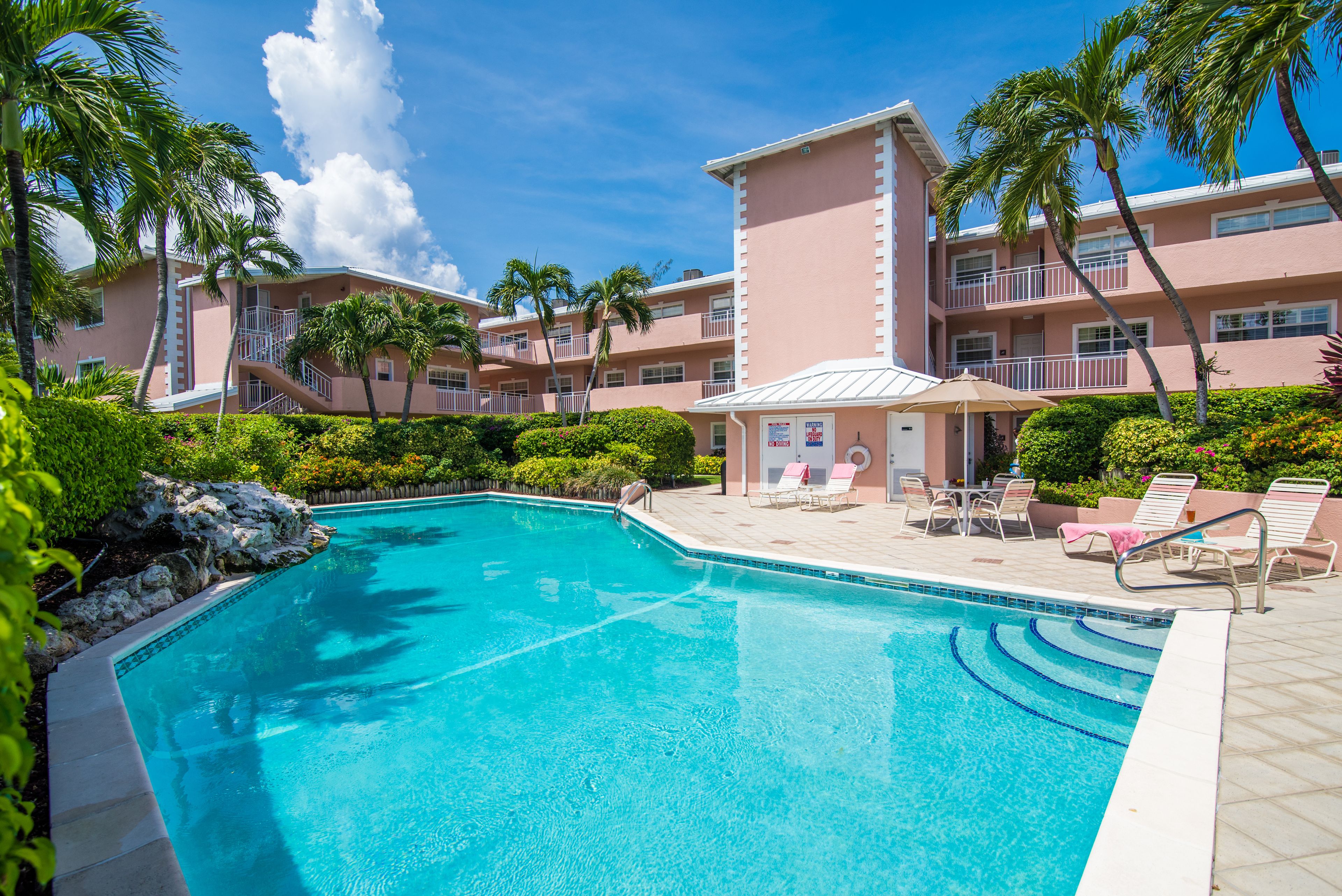 outdoor pool, pool umbrellas, pool loungers