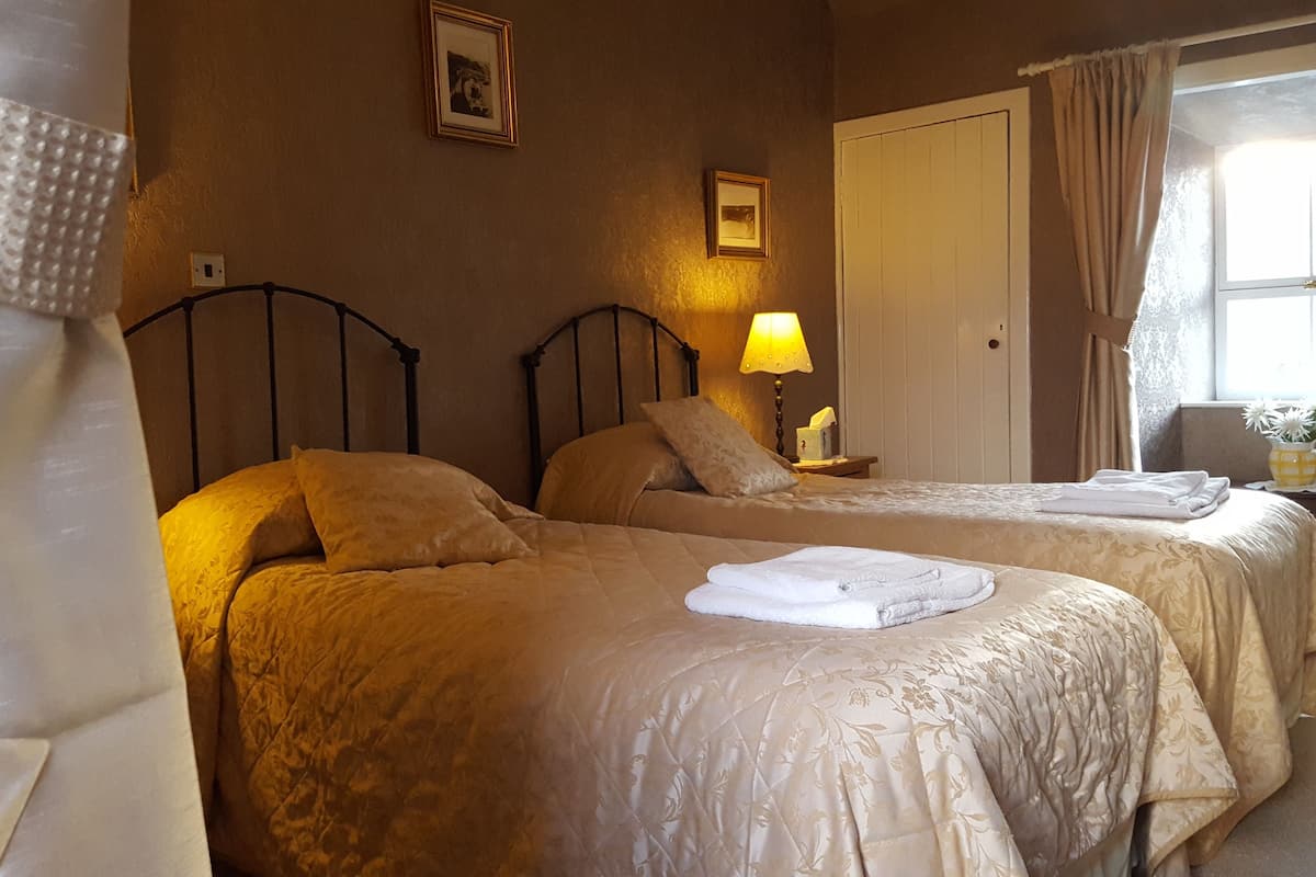 twin room | in-room safe, individually decorated, individually furnished, desk