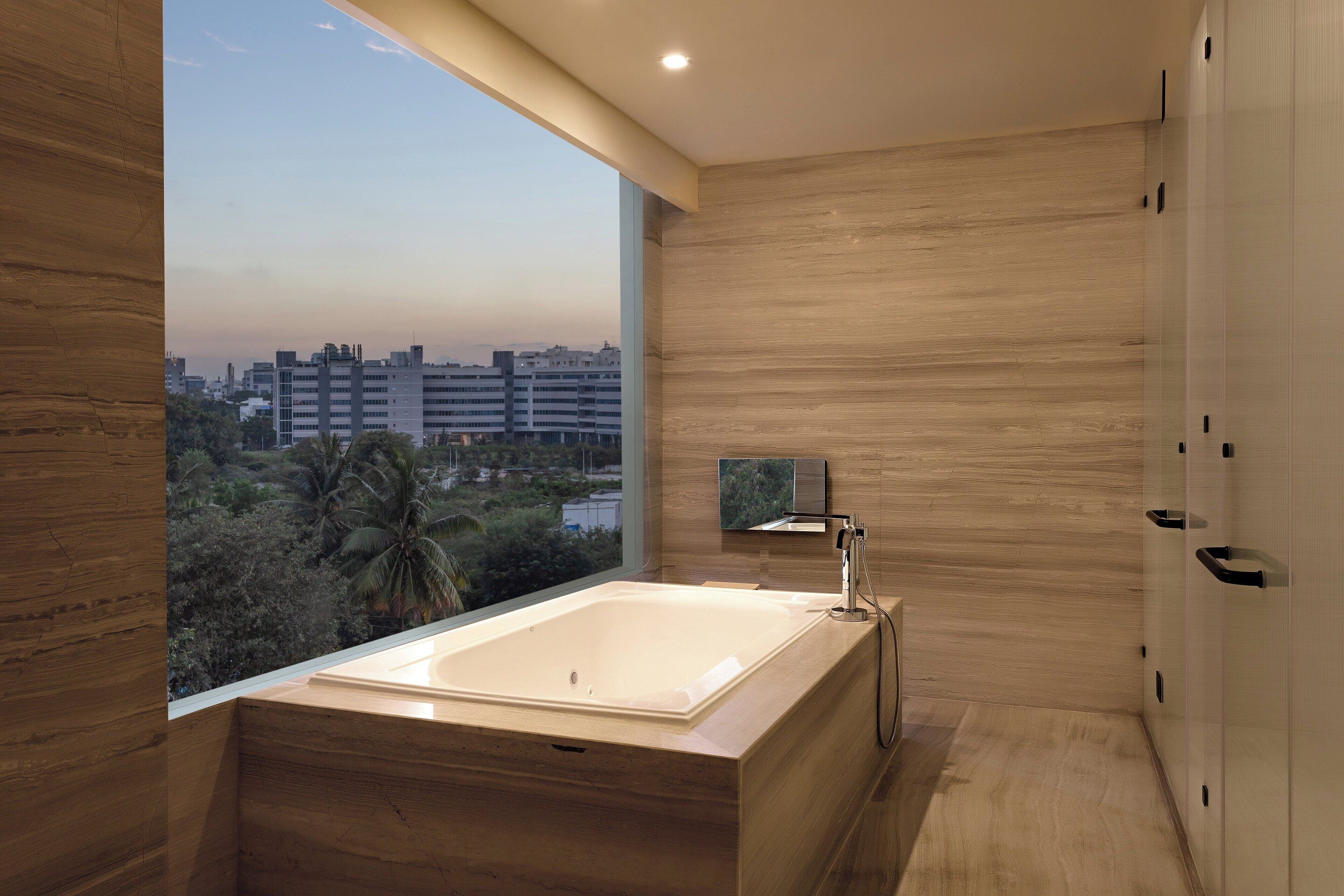 deep-soaking bathtub, designer toiletries, hair dryer, bathrobes