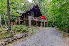 A cabin with a stone foundation, wooden deck, and a covered porch area. - Luxury Cabin 4 Miles from Ski Slopes (Beech Mountain)