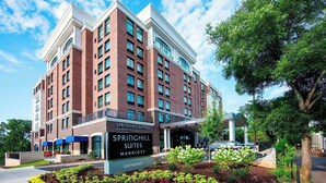 A multi-story hotel with a brick facade, large windows, and a sign indicating it is Springhill Suites Marriott. - SpringHill Suites by Marriott Athens Downtown/University Area (Athens)