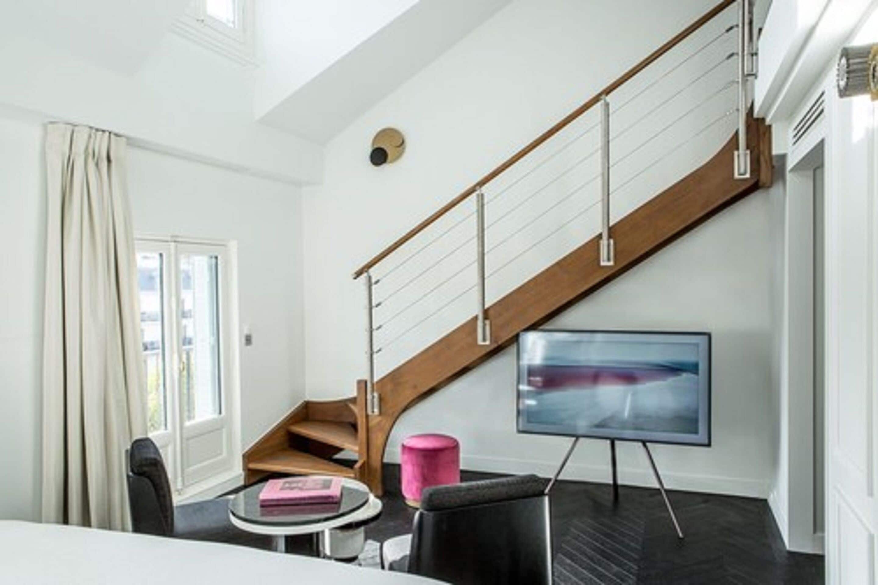 duplex eiffel tower suite | living room | flat-screen tv, tablet, netflix