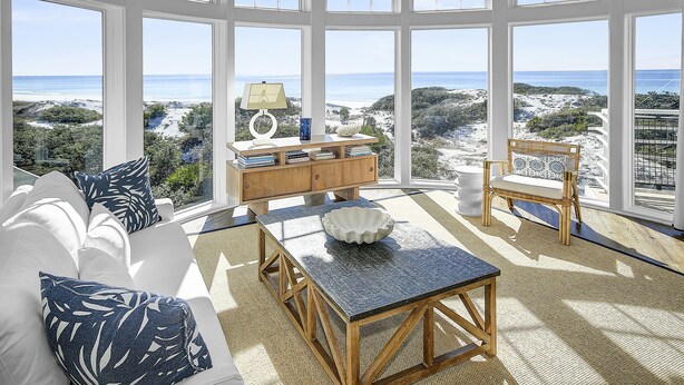 A spacious room with a large bay window overlooking a beach and ocean. - Gulf Front Penthouse Condo * Complimentary LSV 407 Compass Point 1, WaterSound - 3 BR, SLPS 8 (Panama City Beach)