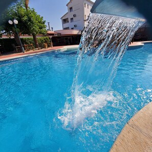 Seasonal outdoor pool, pool loungers