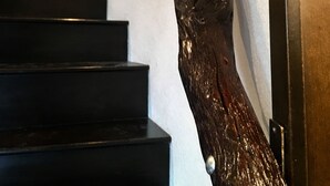 A staircase with a unique wooden sculpture at the top. - Country get away in Waxahachie, TX on 10 acres Shared with The Yurt in the Woods (Waxahachie)