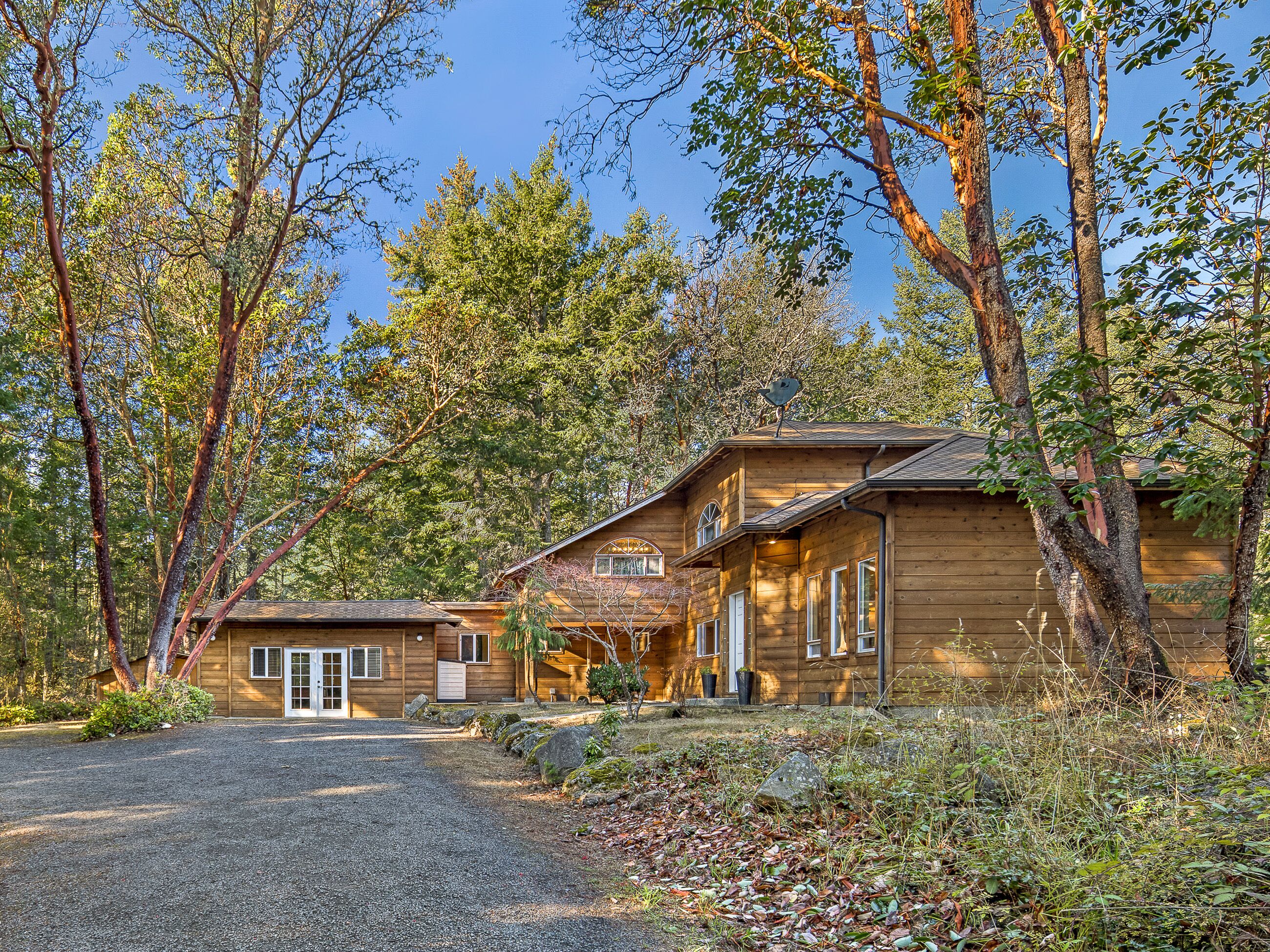 Woodhaven is surrounded by madrona trees.